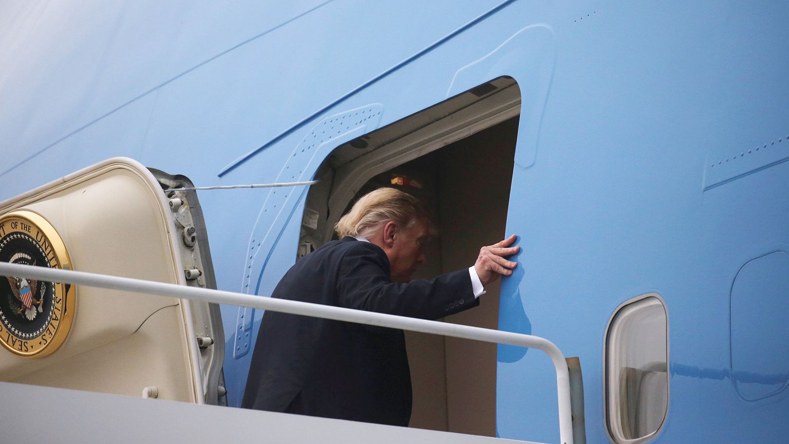 Image: President Donald Trump boards Air Force One after his summit with No