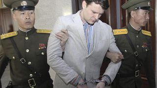 Image: Otto Warmbier is escorted at the Supreme Court in Pyongyang