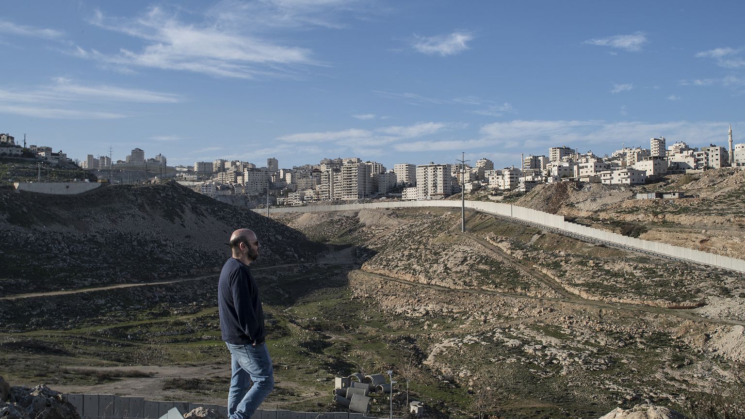 Image: Anti-settlement activist Shabtay Bendet surveys the highway critics 