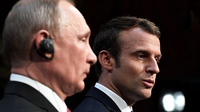Vladimir Putin shows little appreciation of Emmanuel Macron's speech