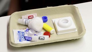 Image: A HIV testing kit is displayed during the visit by Prince Harry to t