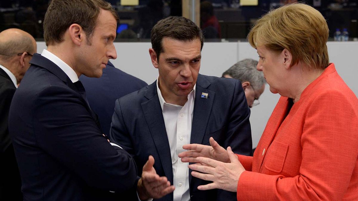 Το ελληνικό χρέος συζήτησαν Τσίπρας, Μέρκελ και Μακρόν - Θα υπάρξει συμφωνία στο Eurogroup λέει ο Μοσκοβισί