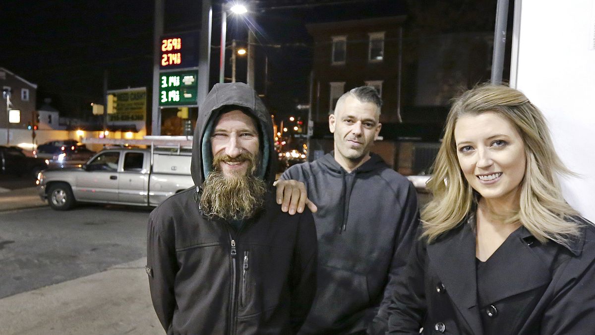 Johnny Bobbitt Jr., left, Kate McClure, right, and McClure's boyfriend Mark