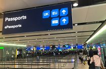 Image: Signage is seen at the UK border control point at the arrivals area