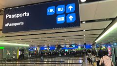 Image: Signage is seen at the UK border control point at the arrivals area 