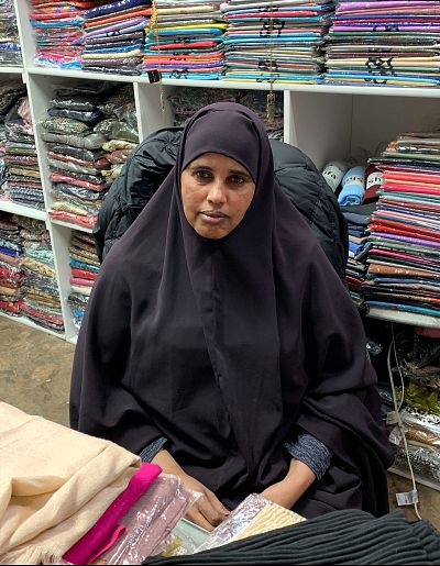 Anab Ibrahim, owner of a women\'s boutique and a Somali-American, in her shop at the Village Market.