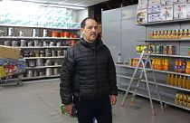 Image: Bouihrouchane Mbark pictured alongside the empty meat section of his