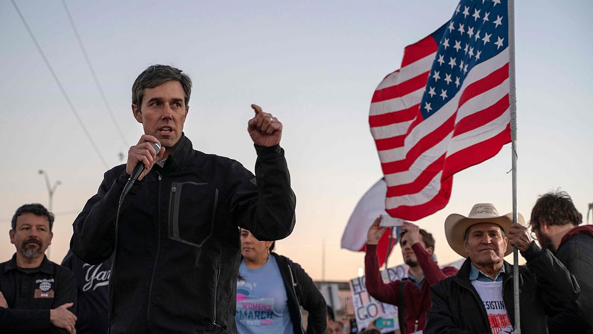 Image: Former Texas Congressman Beto O'Rourke speaks to a crowd of marchers