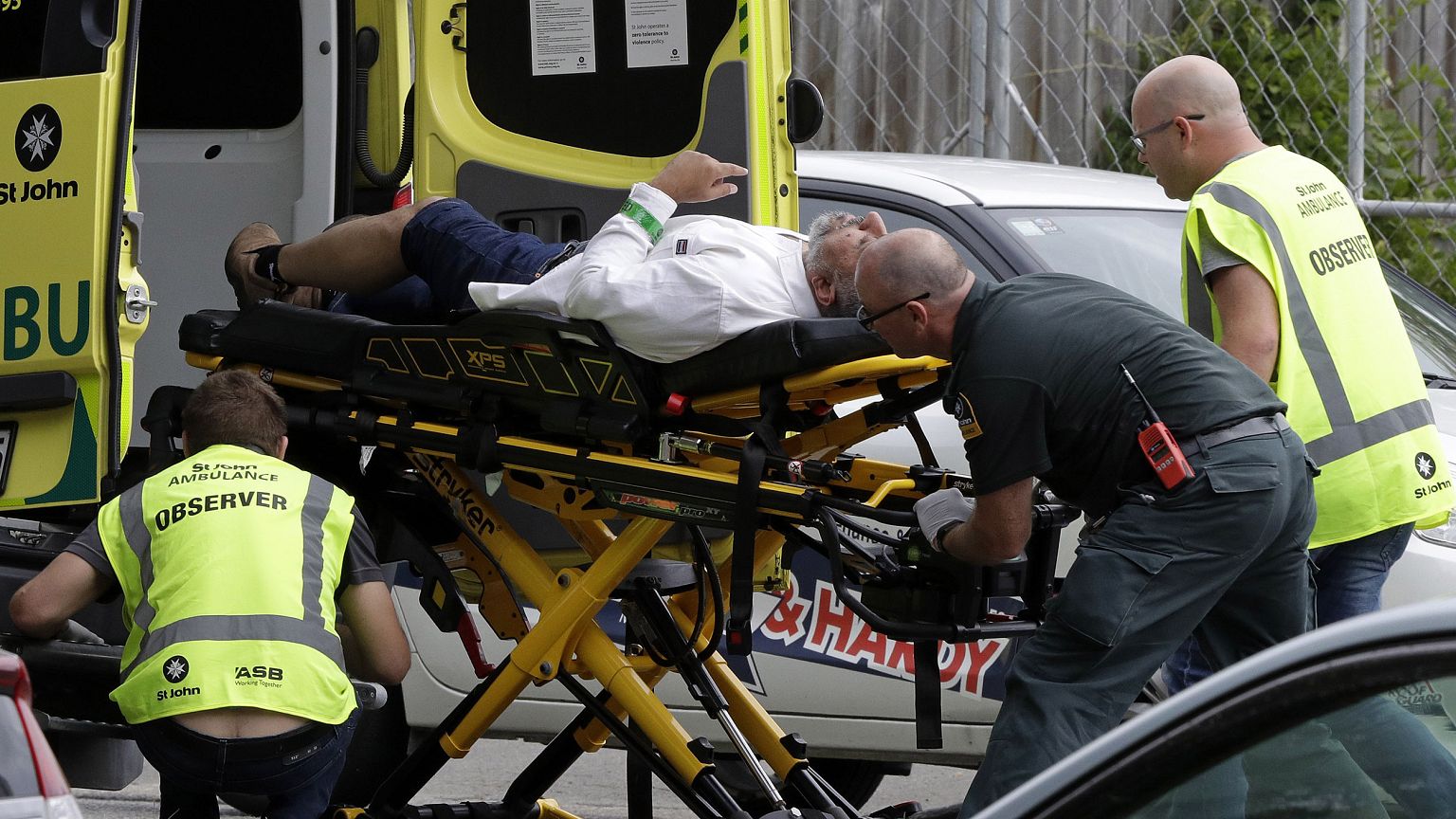 Image: Ambulance staff take a man from outside a mosque in central Christch