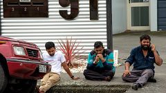 Image: Grieving members of the public following a shooting at the Al Noor m