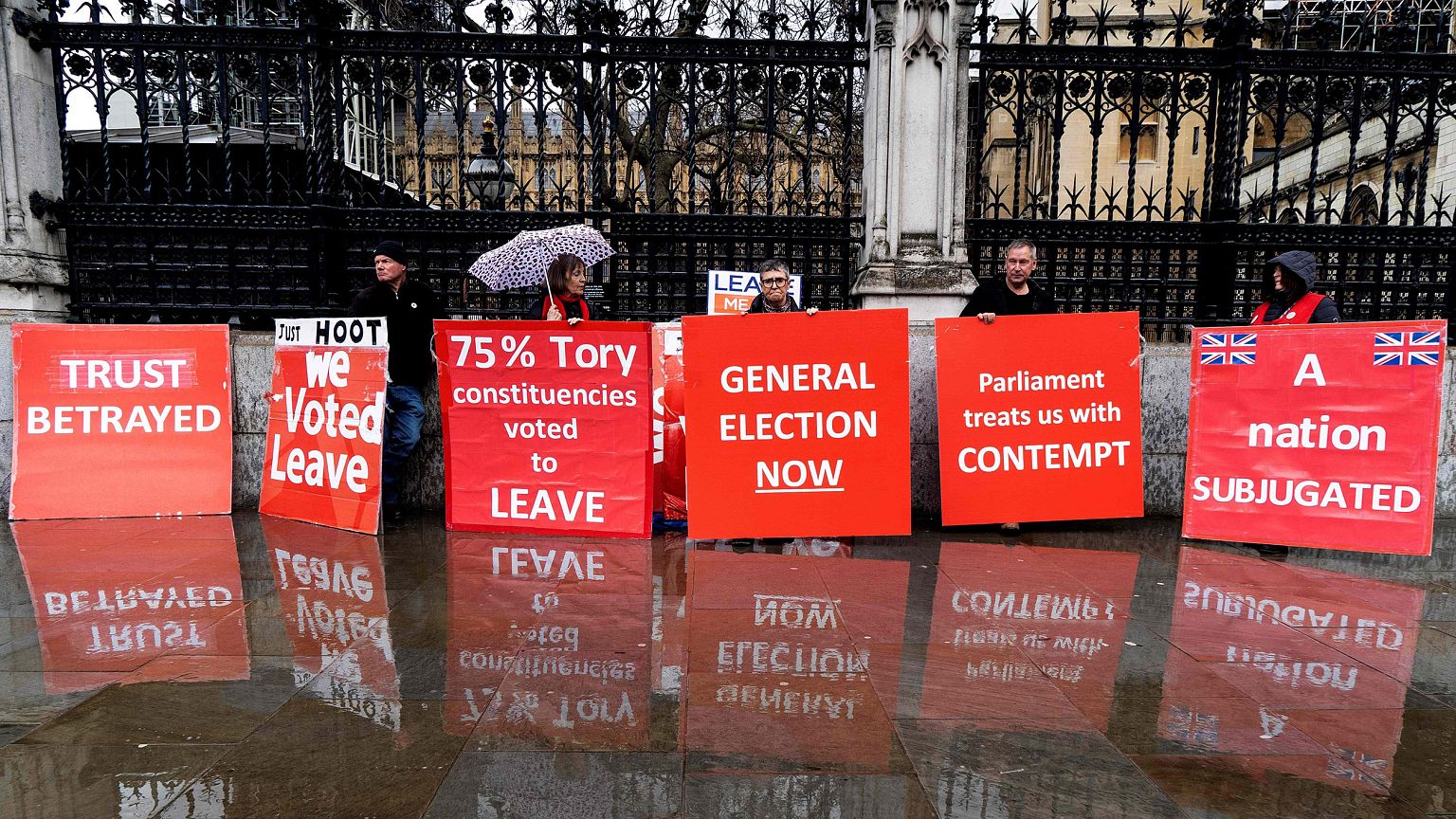 Image: Pro-Brexit activists hold placards as they demonstrate outside the H