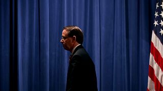 Image: Deputy Attorney General Rod Rosenstein leaves a news conference at t