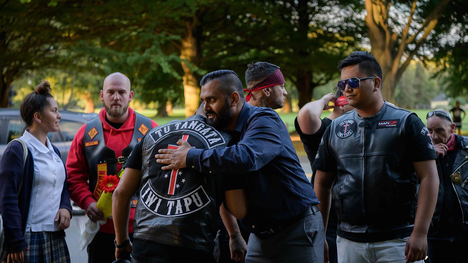 Image: Members of biker gangs arrive before performing the haka in front of