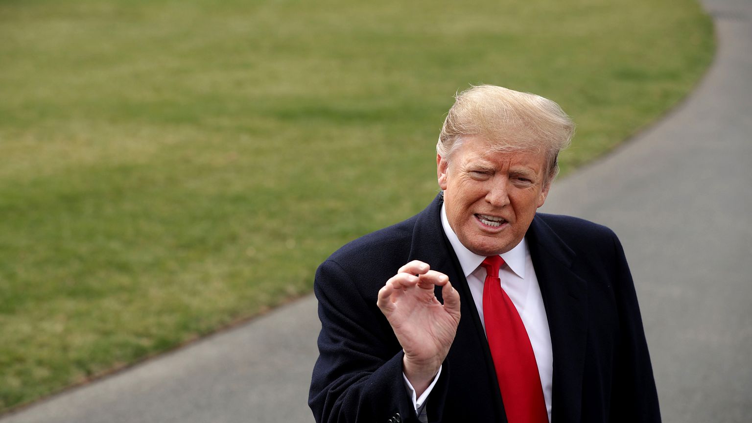 Image: President Donald Trump speaks to the media before departing the Whit