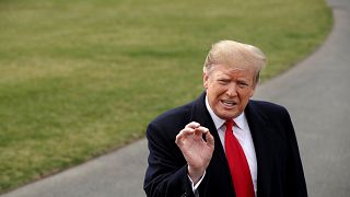 Image: President Donald Trump speaks to the media before departing the Whit