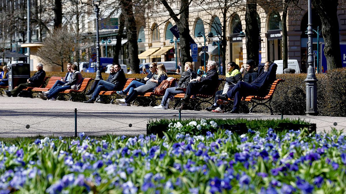 Image: FILE PHOTO: People enjoy a sunny day at the Esplanade in Helsinki