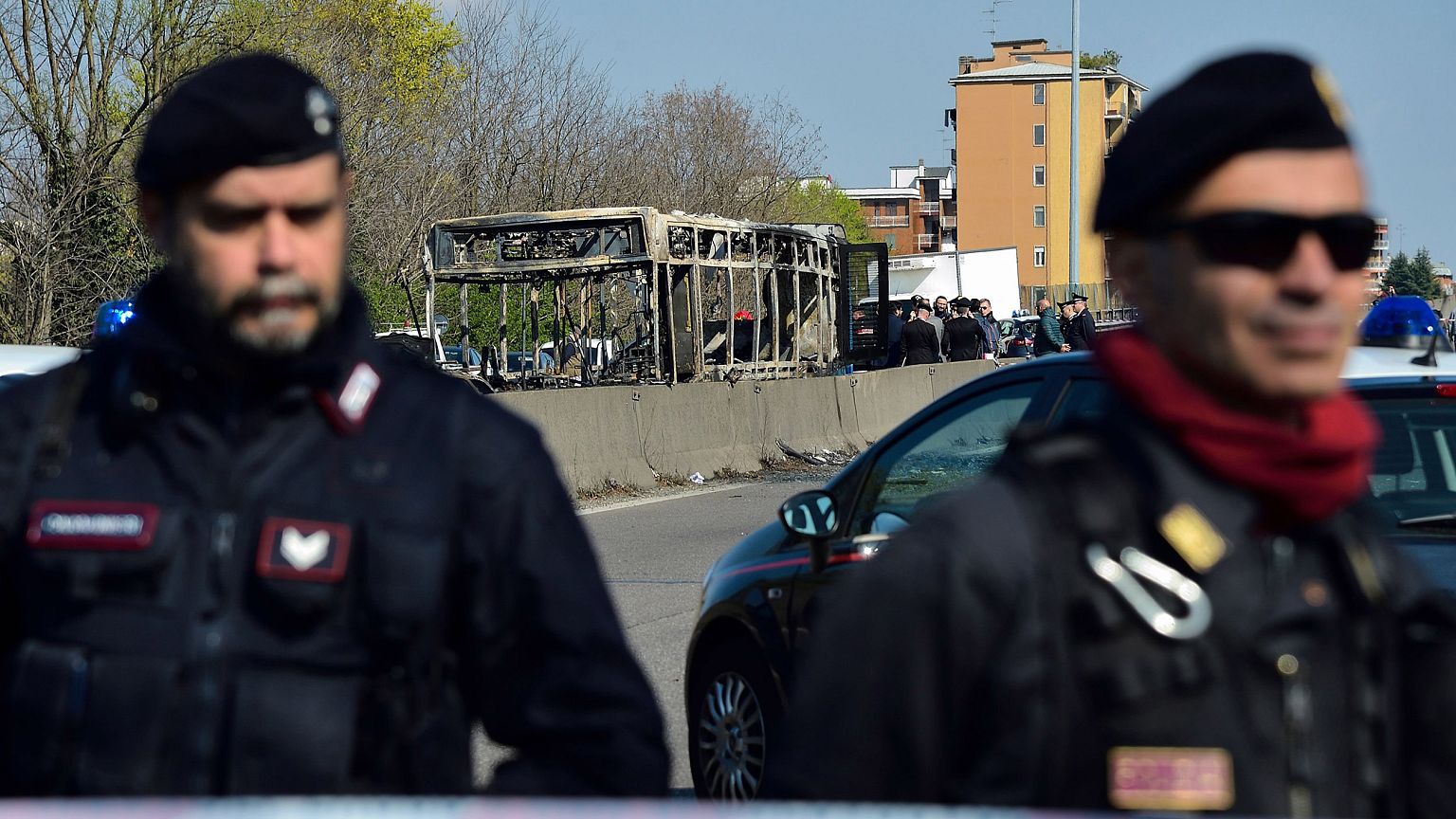 Image: Italian Carabinieri policemen stand by by the wreckage of a school b