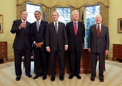 President George W. Bush, from center, meets with President-elect Barack Obama (2nd-L), former President Bill Clinton (2nd-R), former President Jimmy Carter, from right, and former President George H.W. Bush, from left, in the Oval Office on January 7, 2009.