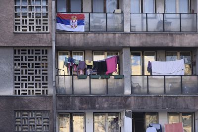 A Serbian national flag is hung from an apartment  in the north of Mitrovica.