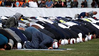 Image: People perform the Friday prayers at Hagley Park outside Al-Noor mos