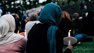 Image: People attend a vigil for the lives taken in the Christchurch terror