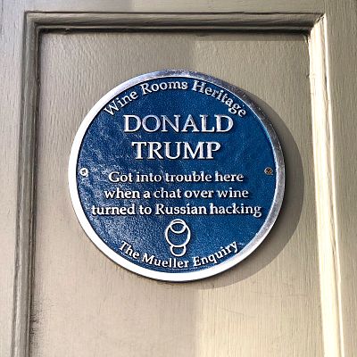A blue plaque outside the Kensington Wine Rooms in London memorializes its role in the Trump investigation.