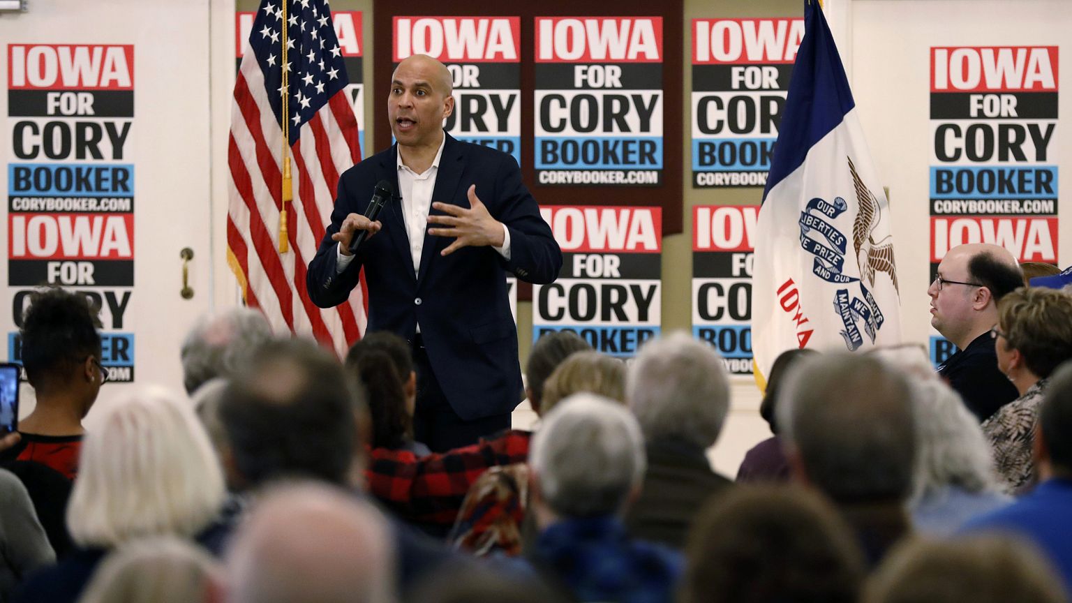 Image: Sen. Cory Booker speaks during a meeting with local residents during