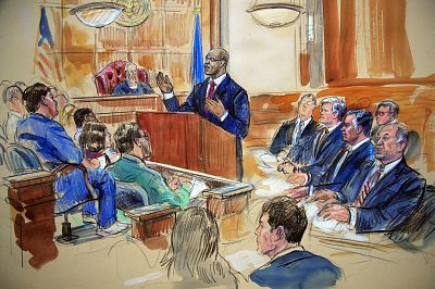Paul Manafort, seated second row from right, listens as Assistant U.S. Attorney Uzo Asonye makes opening arguments during Manafort\'s trial in 2018.