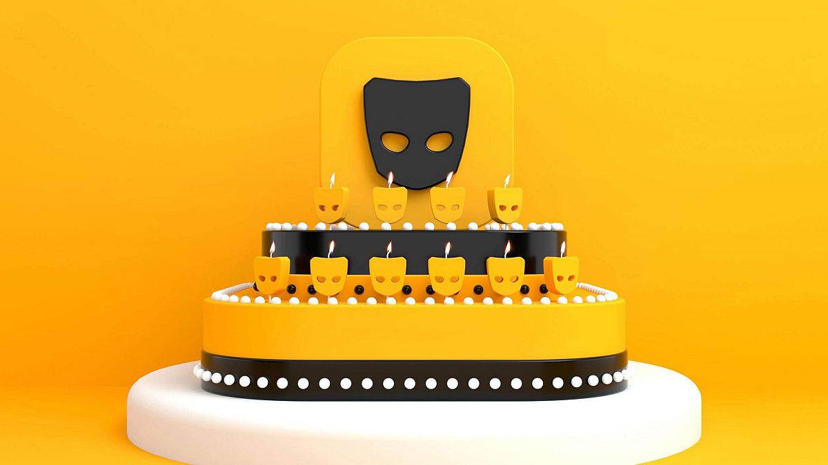 Illustration of a cake with Grindr logo candles burning.