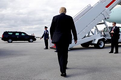 President Donald Trump walks to Air Force One in West Palm Beach, Florida, on Sunday.