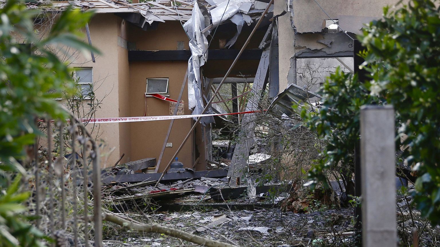 Image: Damage to a house hit by a rocket in Mishmeret, central Israel