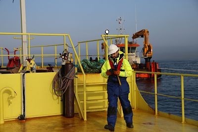 Engineers prepare to connect the tidal energy converter by Magallanes Renovables to the grid from the Fall of Warness in Scotland on Feb. 27.