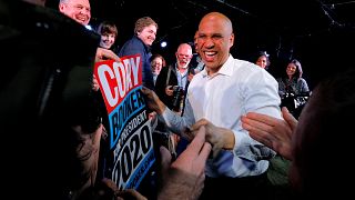 Image: Sen. Cory Booker, D-NJ, greets audience members at a campaign stop i