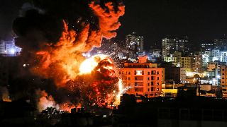 Image: Fire and smoke billow above buildings in Gaza City during reported I