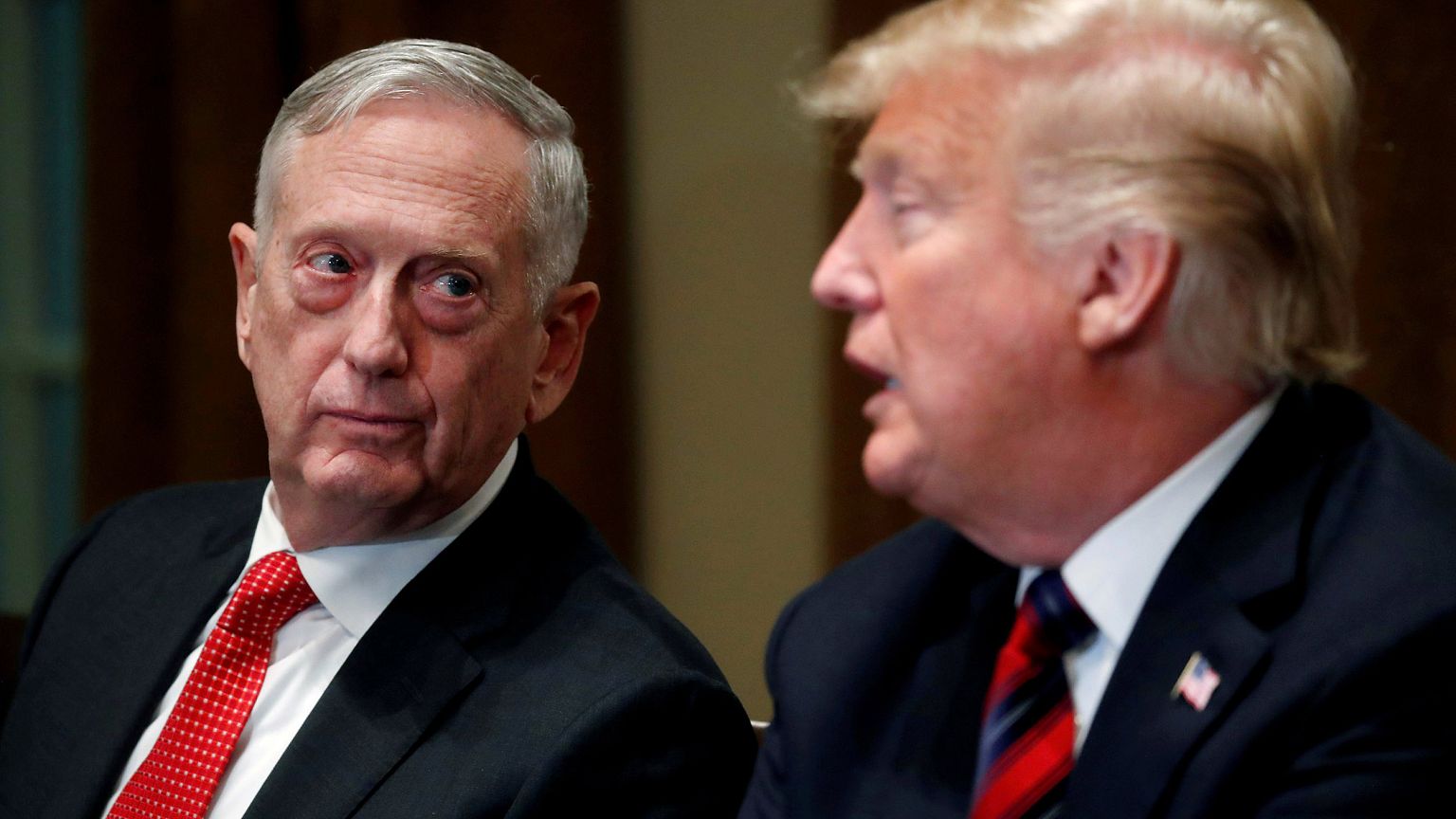 Image: Defense Secretary James Mattis listens as U.S. President Donald Trum