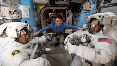 Image: NASA astronaut Anne McClain assists fellow astronauts Christina Koch