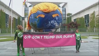 Demo in Berlin calls on Merkel to stop US derailing climate change policy