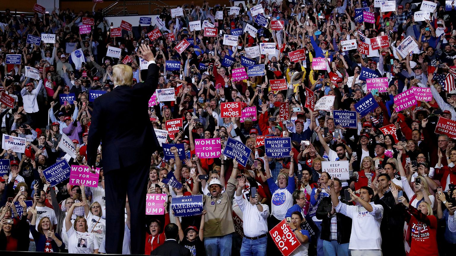 President Trump greets the crowd at a campaign rally in Houston