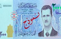 چاپ تصویر بشار اسد روی اسکناس های سوری