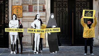 Image: Demonstrators from Amnesty International protest outside the Saudi A