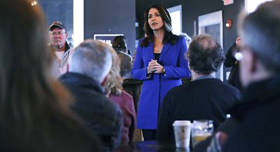 Tulsi Gabbard addresses a gathering during a campaign stop at a brewery in Peterborough, New Hampshire, on March 22, 2019.