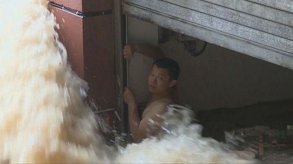 China: a narrow escape from a flooded car park China: a narrow escape from a flooded car park