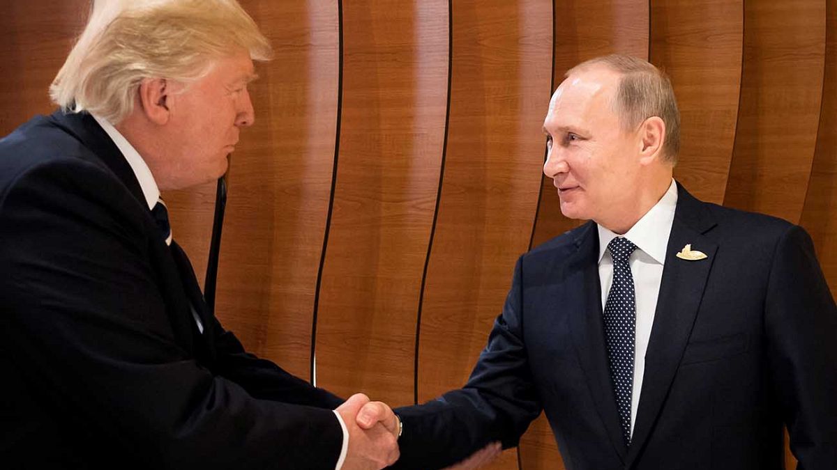 Watch: Trump and Putin shake hands during first face-to-face meeting