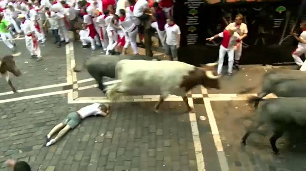 Man tossed and dragged by bulls in Pamplona Man tossed and dragged by bulls in Pamplona