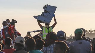 Image: Debris is removed from the crash site of the Ethiopian Airlines jet 