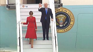 Trump lands in Paris for talks and tourism