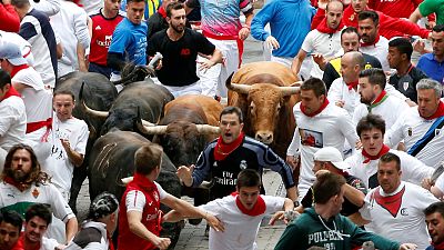 Eight injured after bulls rampage through Pamplona