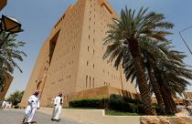 Image: Saudi men walk outside the General Court in Riyadh