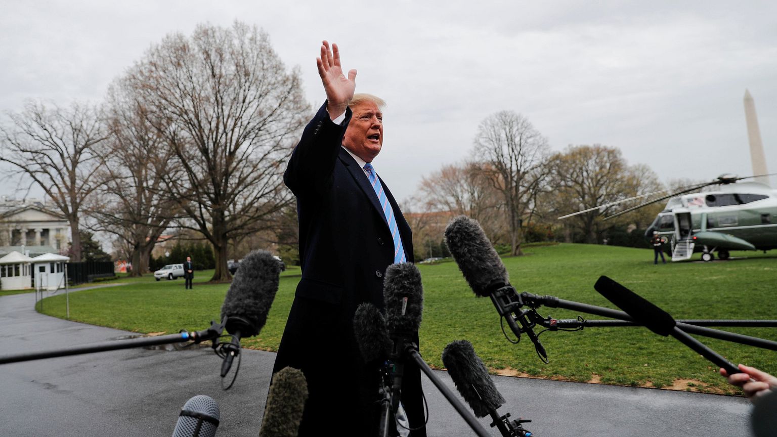 Image: U.S. President Trump talks to reporters departing on travel to the U