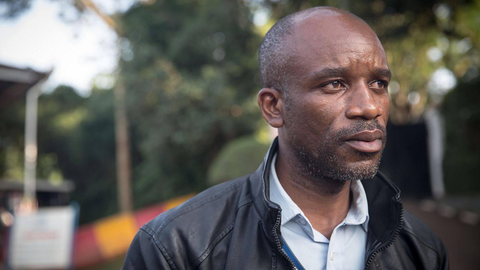 Image: Gratien Zimy Ntezimisi, a refugee whistleblower, standing outside UN